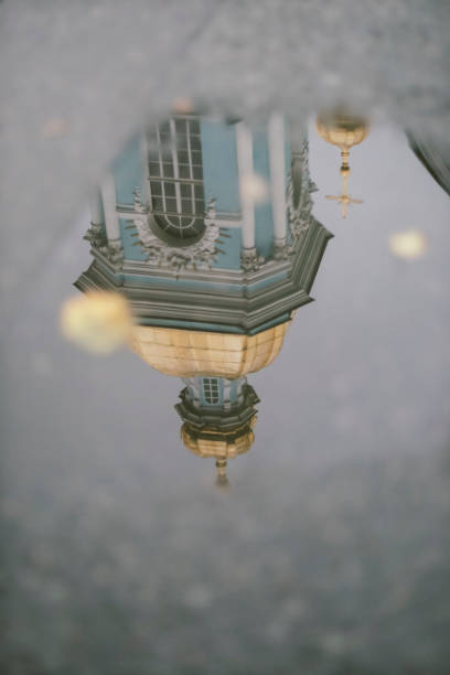 istock Golden dome cross shaped dome orthodox church reflected on a puddle 1085645410