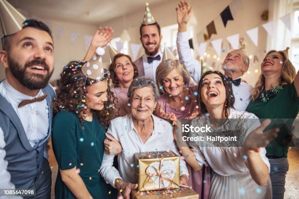 A Portrait Of Multigeneration Family With Presents On A Indoor Birthday Party Stock Photo - Download Image Now
