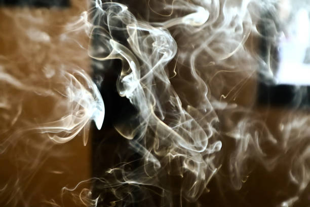 Smoke steam in room lighten by sun light smoke background