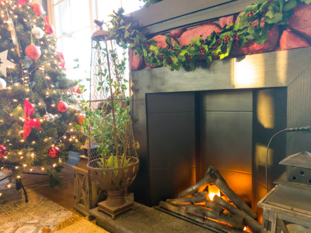 istock decorated christmas tree front of the fireplace 1085654474