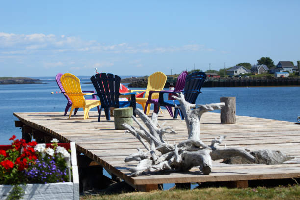 istock Plastic chairs on a small pier at Briar Island, Nova Scotia, Canada 1085655112