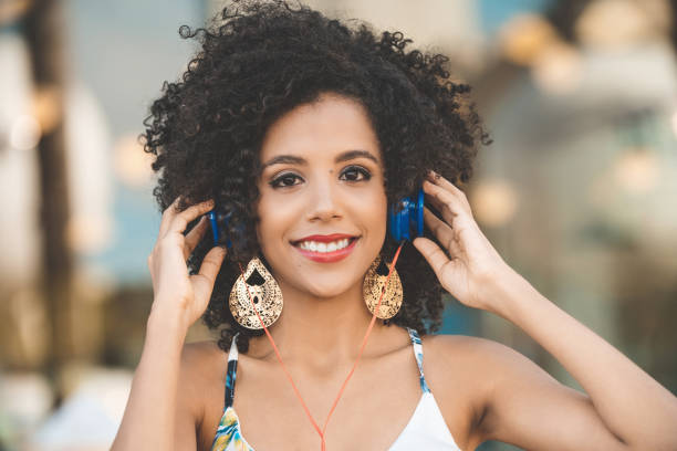 istock Young woman wearing headphones 1085656518