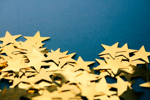 istock Golden stars on black background 1085656534