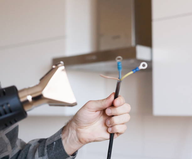 istock Apartment-repair. Hands, wire, electric drier, close up 1085659788