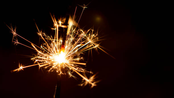 istock Christmas sparkler isolated on black background. Bengal fire 1085659912