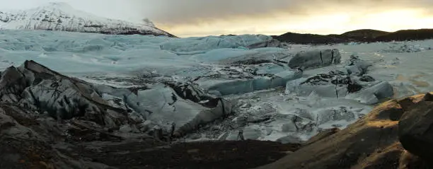 Photo of Ice of the Svínafellsjökull Glacier after sunset in Iceland.