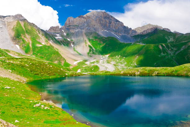istock Lake. Mountain summer. Sunny day. Green grass 1085679606