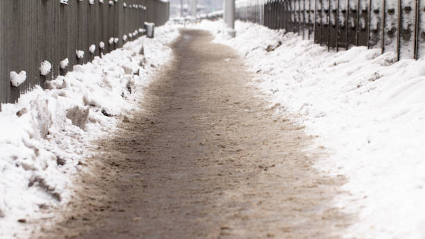 istock Snowy rural street with a light frosty direction 1085683998