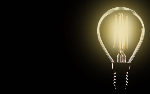 istock Silhouette led lamps against yellow background 1085684112