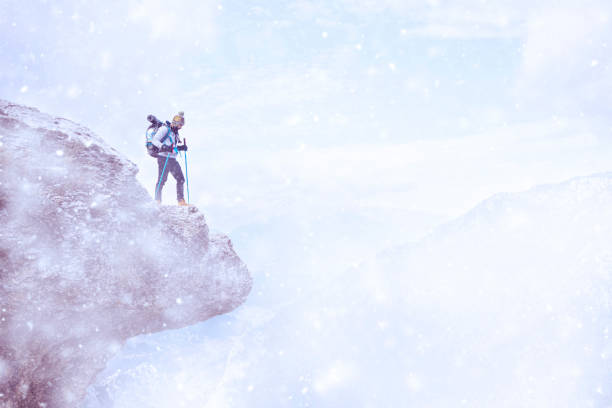 istock Young hiker on snowy mountain peak. 1085686530