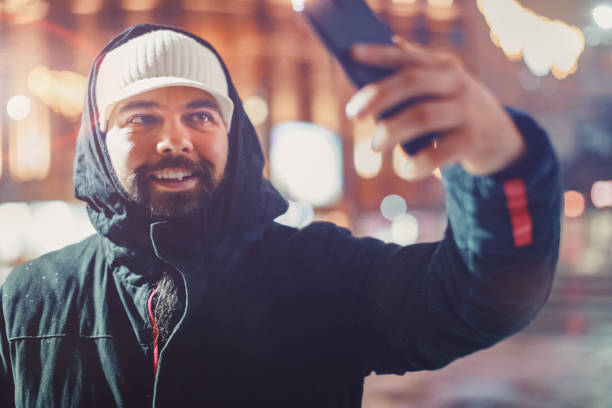 istock Young man Taking a Selfie at Night 1085696050