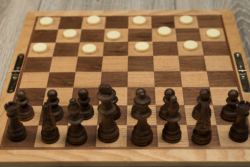 Close-up of a senior man playing chess in a city square