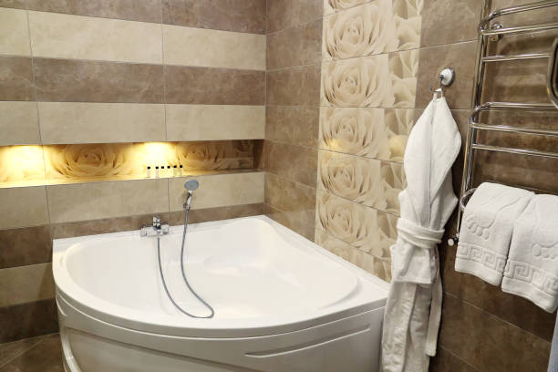 istock Shower and a bath in modern bathroom in hotel 1085713254