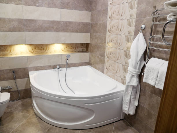 istock Shower and a bath in modern bathroom in hotel 1085713262