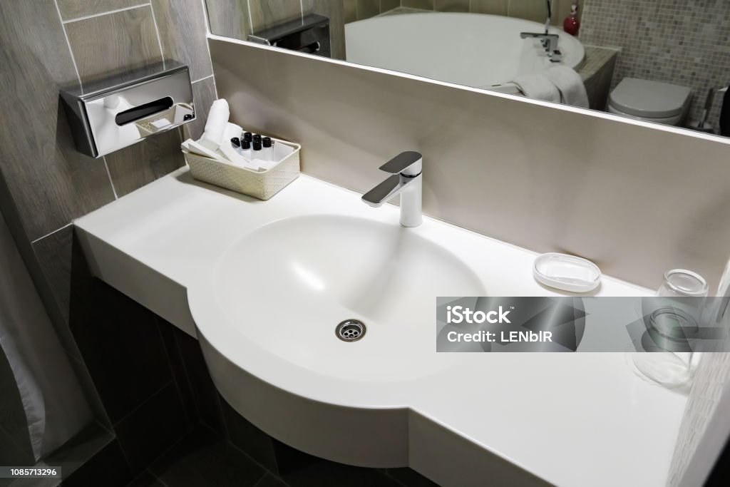 Bathroom interior with white sink and faucet Bathroom interior with white sink and faucet. Apartment Stock Photo