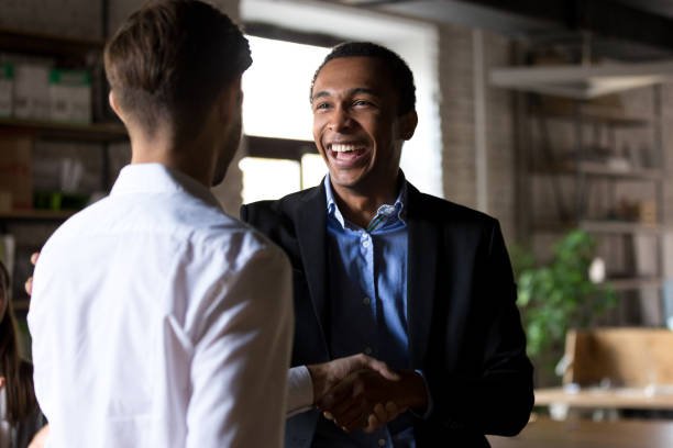 istock Happy black ceo handshaking rewarding successful worker, employee recognition concept 1085713984