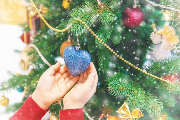 istock Child happy over christmas background. Christmas tree. Selective focus. 1085726530