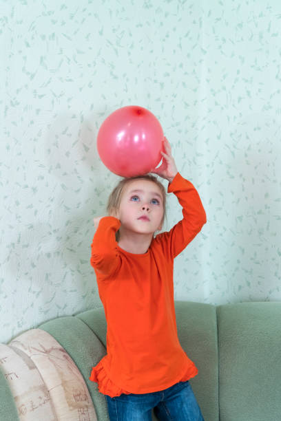 istock child hits the balloon 1085730226