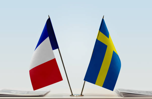 Flags of France and Sweden stock photo