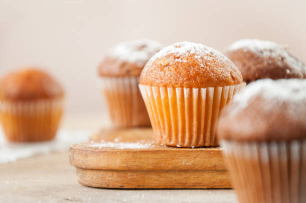 istock Tasty muffin closeup on a wooden board, selective focus. 1085737778