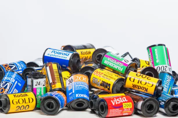 Minsk, Belarus-May 30, 2015: Bulk Variety of Old Photo Films Cassettes of Different World Leading Manufacturers Placed in Heap Together against White Background shot in Studio on May 30, 2015 in Minsk, Republic of Belarus