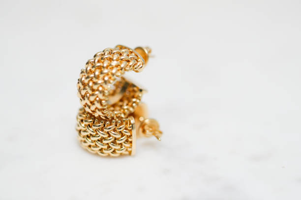 istock yellow gold hoop earrings 1085749596