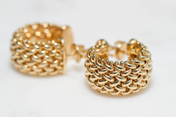 istock yellow gold hoop earrings 1085749610