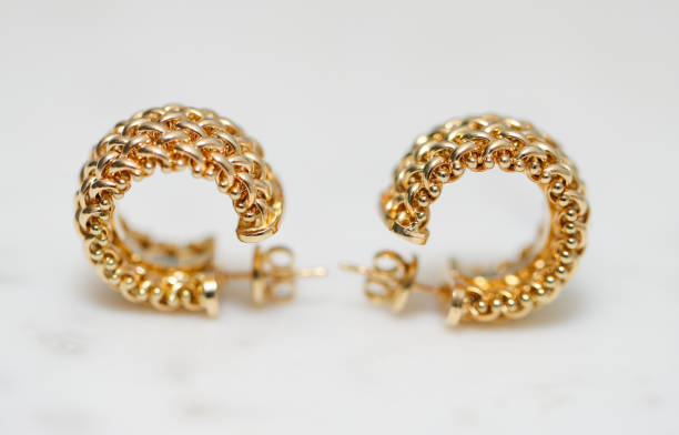 istock yellow gold hoop earrings 1085749618
