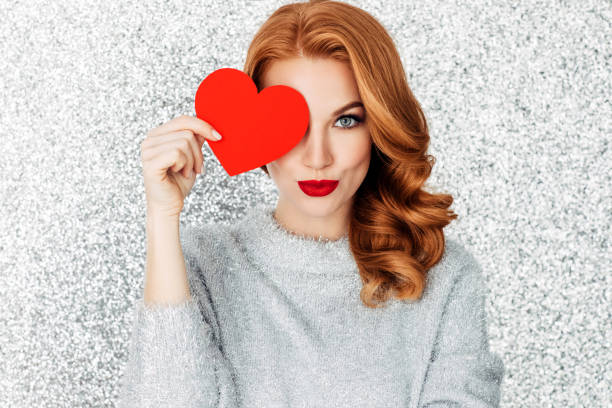 istock Beautiful woman cardboard heart 1085750854