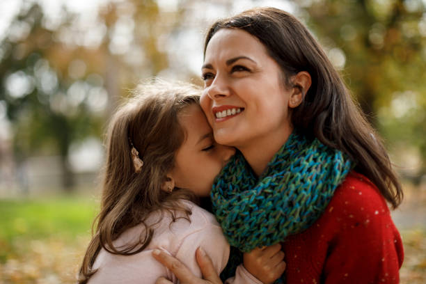 istock Daughter hugging mother in the park 1085751450