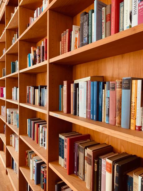 istock Wooden brown books shelves 1085754402