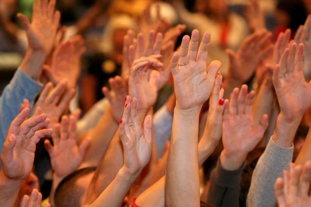 istock raised up a human hands at the event 1085754522