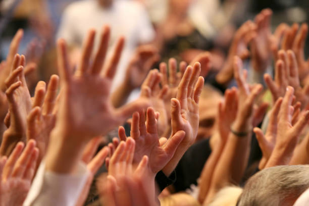 istock raised up a human hands at the event 1085756930