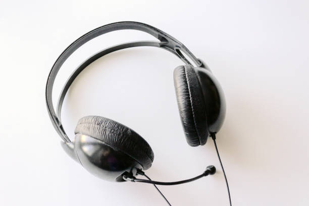 istock Large headphones lie on a white background 1085757332