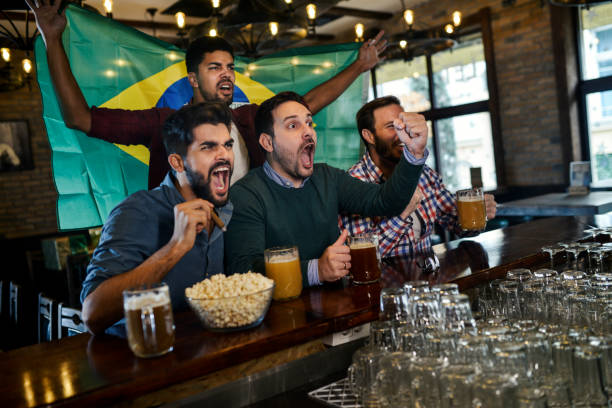 istock Friends in bar watching game 1085758896