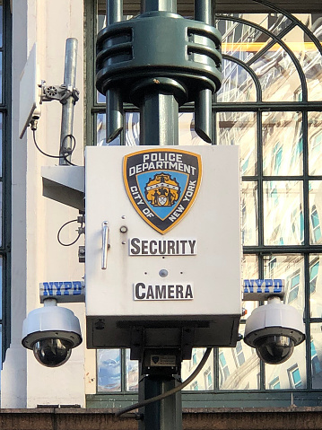 New York, New York-December 7, 2018:  NYPD security cameras keeping watch in front of Macy's department store.
