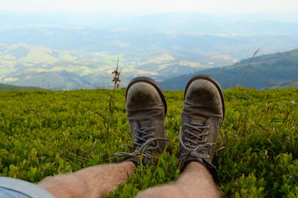istock Traveler legs against mountains valley view 1085763710