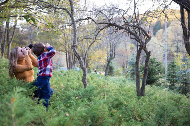 istock Mother and Son taking Photo in nature 1085765376