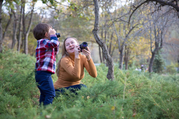 istock Mother and Son taking Photo in nature 1085765638