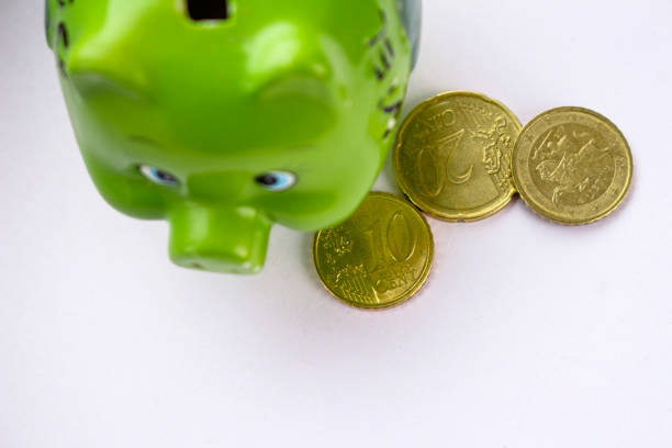 istock green piggy bank with coins 1085774198