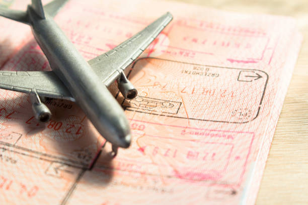 istock small toy airplane on a foreign passport 1085774300