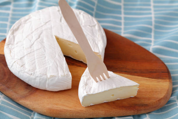 istock Brie cheese on a wooden cutting board 1085778582