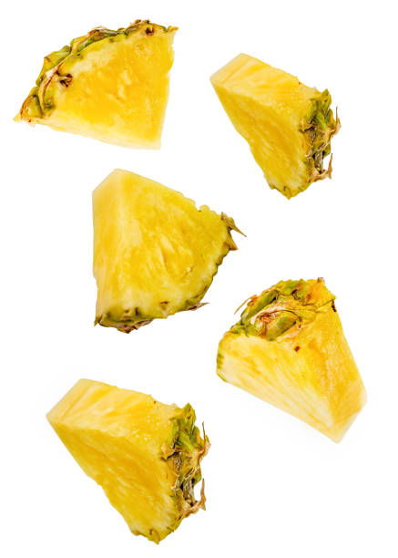 istock pineapple slices flying isolated on white with clipping path 1085788330