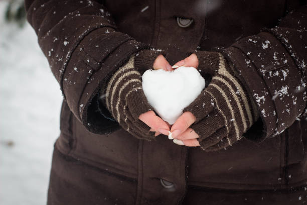 istock Woman with heart in hand 1085792532