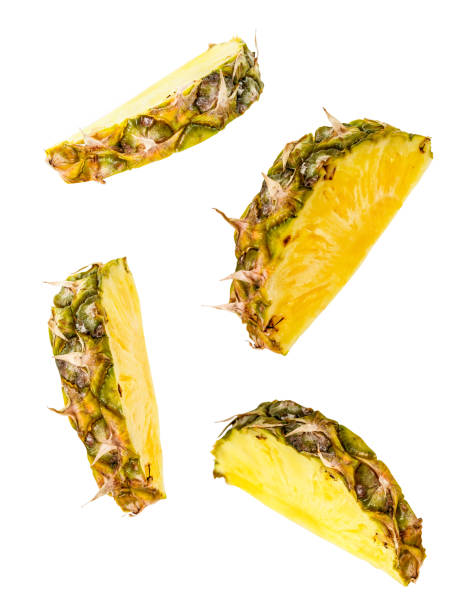 istock pineapple slices flying isolated on white with clipping path 1085792726