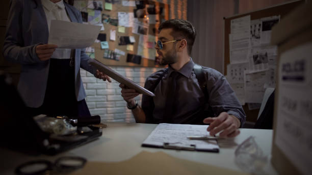 istock Federal bureau investigator looking through files, complicated case, clues 1085792894