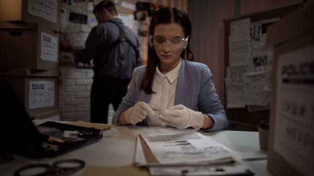 istock Beautiful criminal expert analyzing bullet from the crime scene, investigation 1085793080