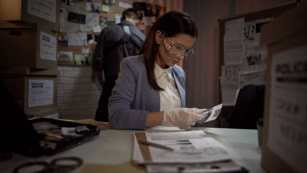 istock Ballistics professional determining information about bullet, police office 1085793108