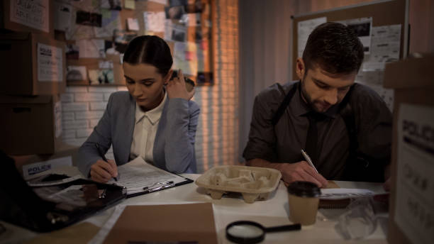 istock Investigation office partners drinking coffee and preparing documents for arrest 1085793206