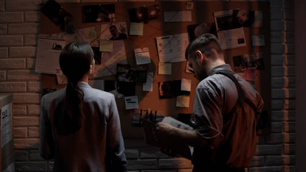 istock Genius detectives analyzing press clipping and photo information about crime 1085793308